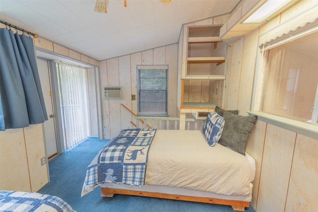 bedroom featuring dark colored carpet, wood walls, a wall unit AC, and vaulted ceiling