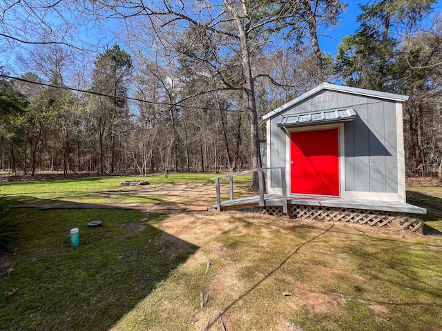 view of outbuilding with a lawn