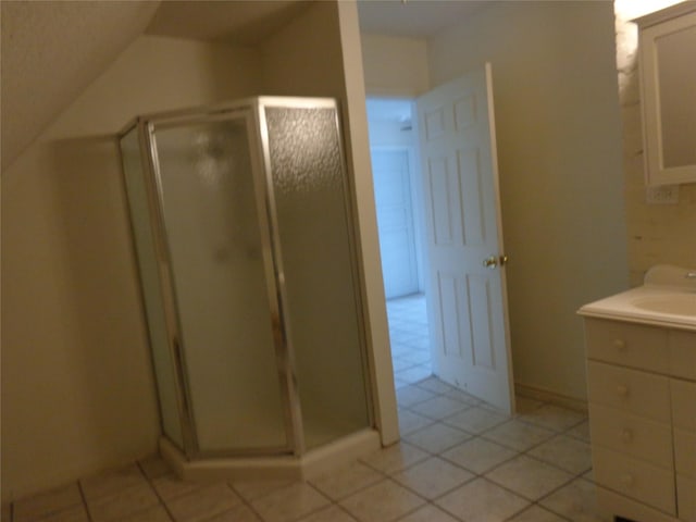 bathroom with vanity, tile patterned floors, and a shower with shower door