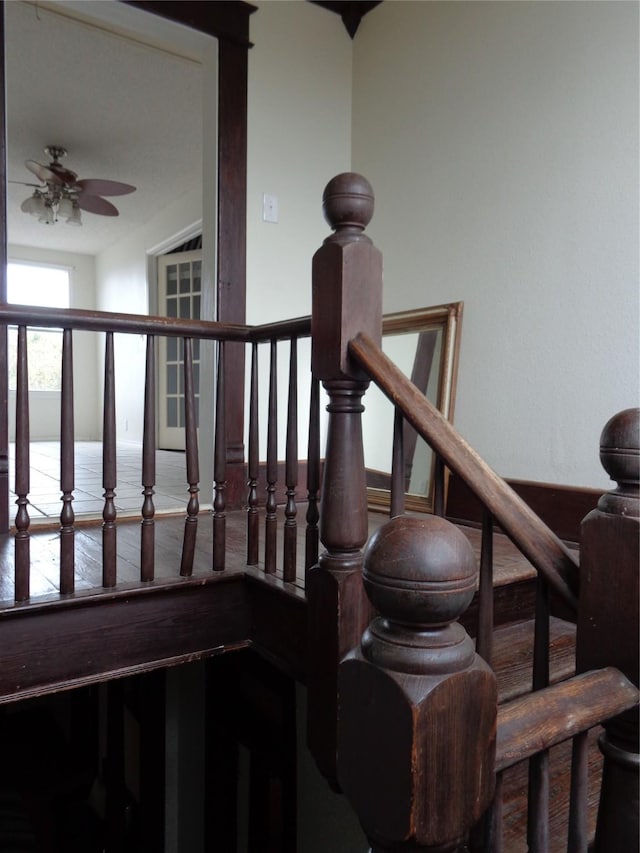 stairs with ceiling fan