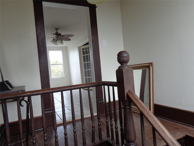 stairs with ceiling fan