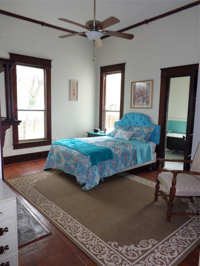 bedroom featuring ceiling fan and dark wood-type flooring