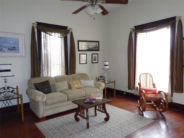 living room with ceiling fan and wood-type flooring