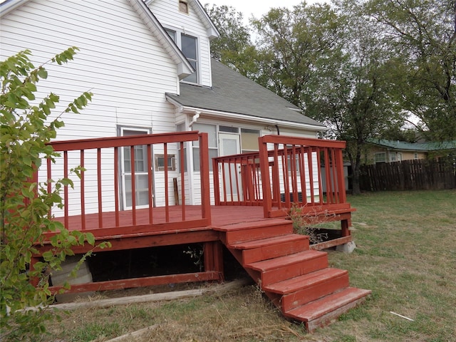 wooden terrace with a yard