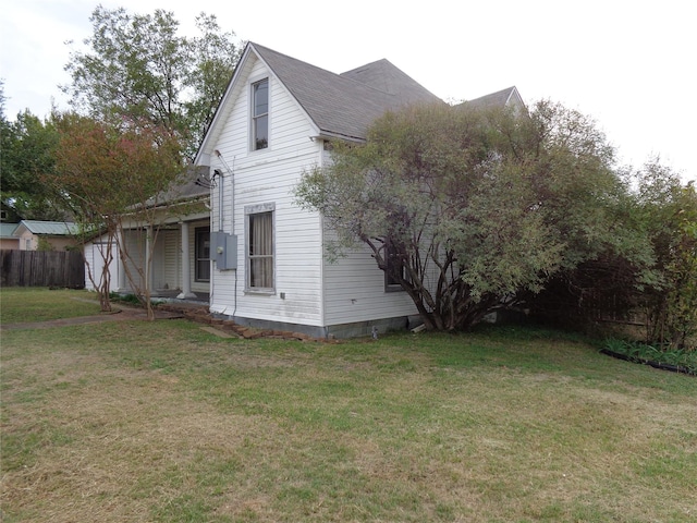 view of home's exterior featuring a lawn