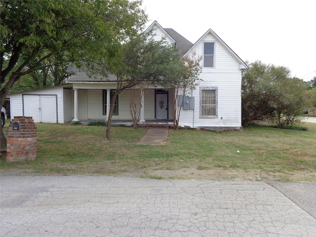 view of front of house featuring covered porch and a front yard