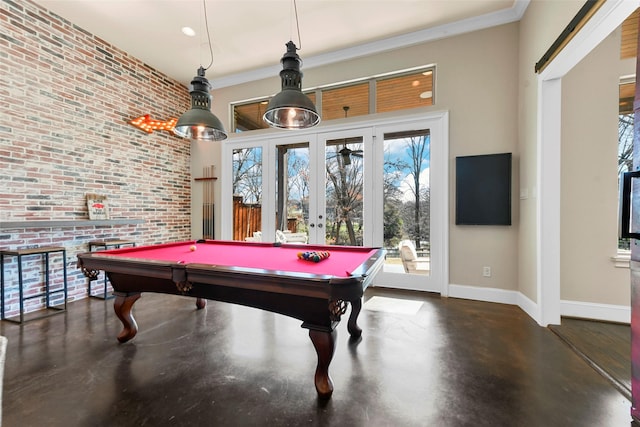 rec room featuring pool table, brick wall, french doors, and ornamental molding