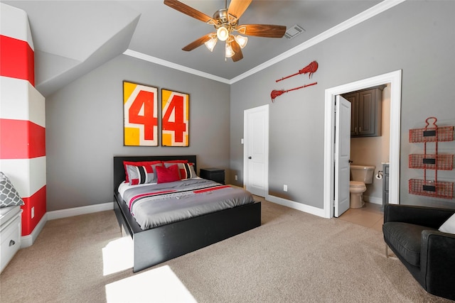 bedroom featuring vaulted ceiling, ensuite bathroom, ornamental molding, ceiling fan, and light carpet