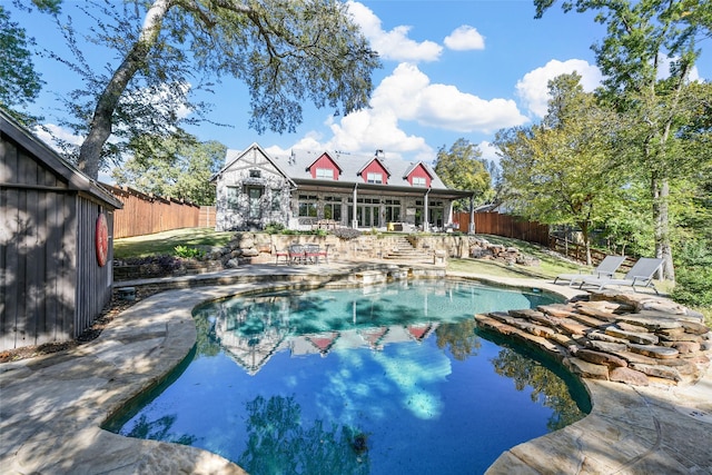 view of swimming pool with a patio area