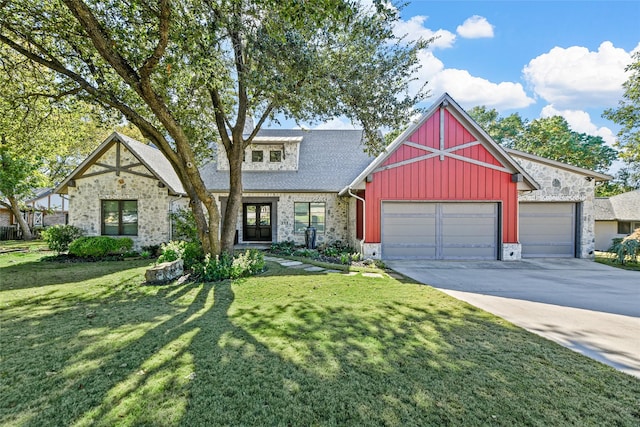 view of front facade featuring a front yard and a garage