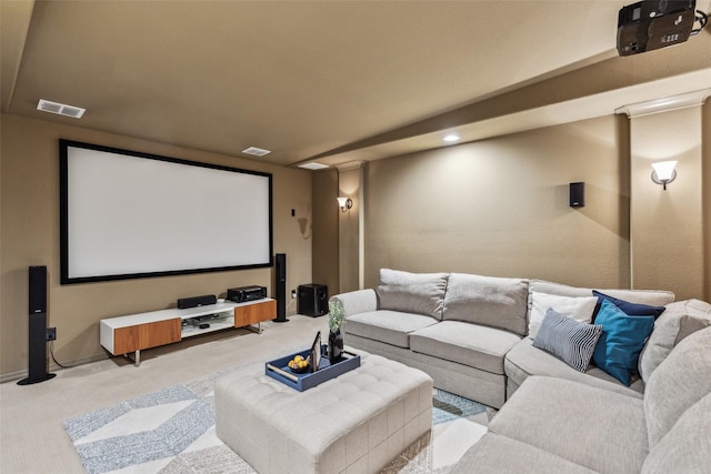 home theater featuring baseboards, visible vents, and carpet floors