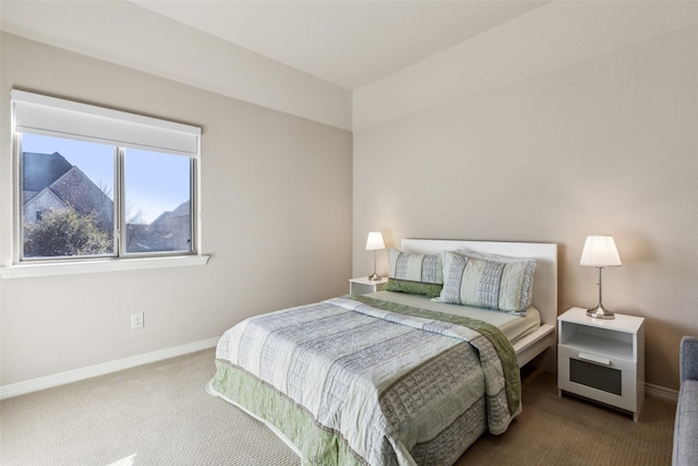 bedroom with carpet and baseboards