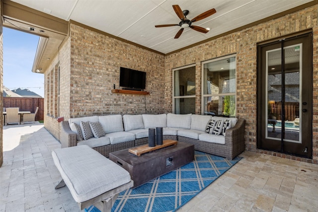 view of patio / terrace with an outdoor living space and a ceiling fan