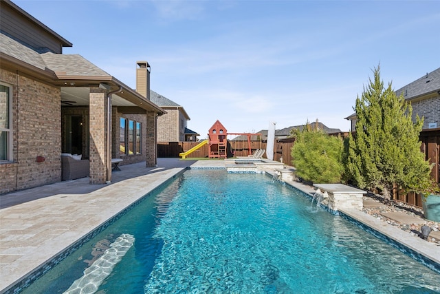 view of swimming pool with a patio area, a fenced backyard, and a fenced in pool