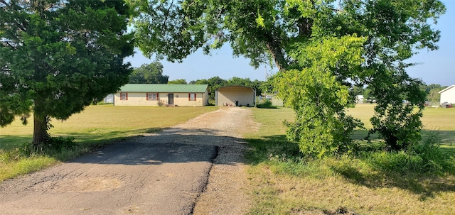 single story home featuring a front lawn