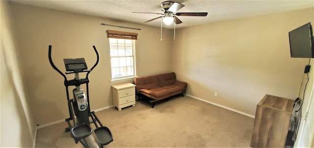 workout room with light colored carpet and ceiling fan