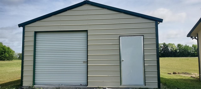 view of outbuilding with a yard