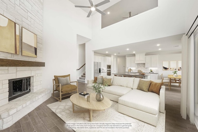 329 Sparkling Springs Dr, Waxahachie, TX 75165 - living area with dark wood-type flooring, stairs, a ceiling fan, a stone fireplace, and recessed lighting
