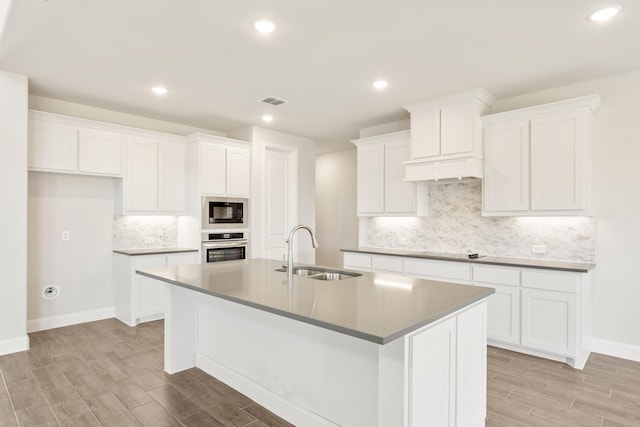329 Sparkling Springs Dr, Waxahachie, TX 75165 - kitchen with a sink, built in microwave, stainless steel oven, light wood-style floors, and recessed lighting
