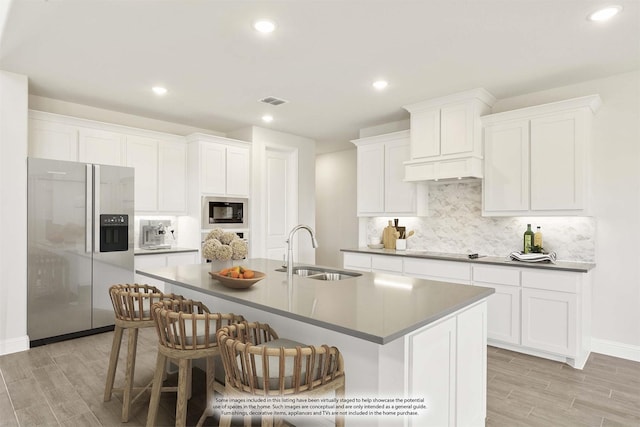 329 Sparkling Springs Dr, Waxahachie, TX 75165 - kitchen with stainless steel refrigerator with ice dispenser, a sink, built in microwave, light wood finished floors, and recessed lighting