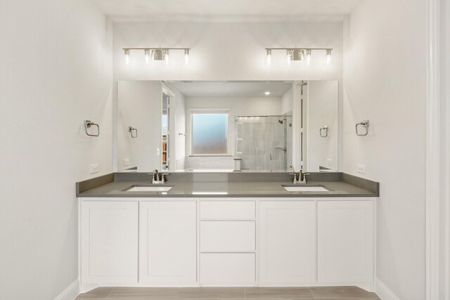 329 Sparkling Springs Dr, Waxahachie, TX 75165 - full bath featuring a shower stall, double vanity, and baseboards
