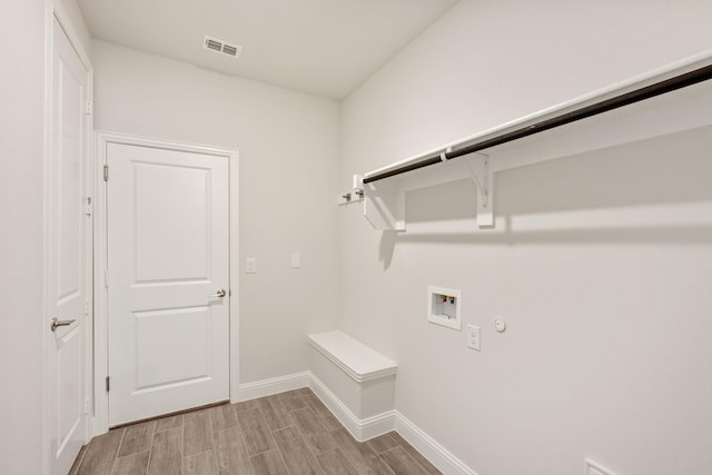 329 Sparkling Springs Dr, Waxahachie, TX 75165 - laundry area featuring hookup for a washing machine, hookup for a gas dryer, wood tiled floors, and baseboards