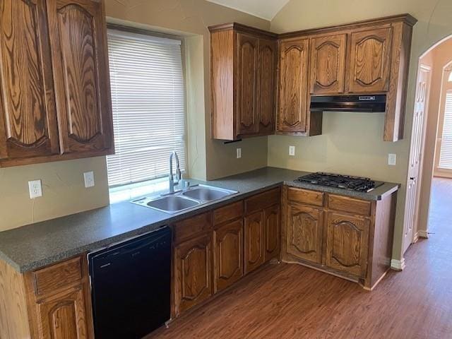 kitchen with stainless steel gas cooktop, sink, dark wood-type flooring, and black dishwasher