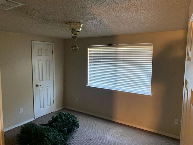 interior space featuring a textured ceiling