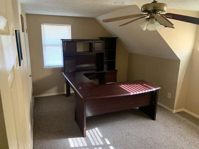 carpeted office with ceiling fan, a textured ceiling, and vaulted ceiling