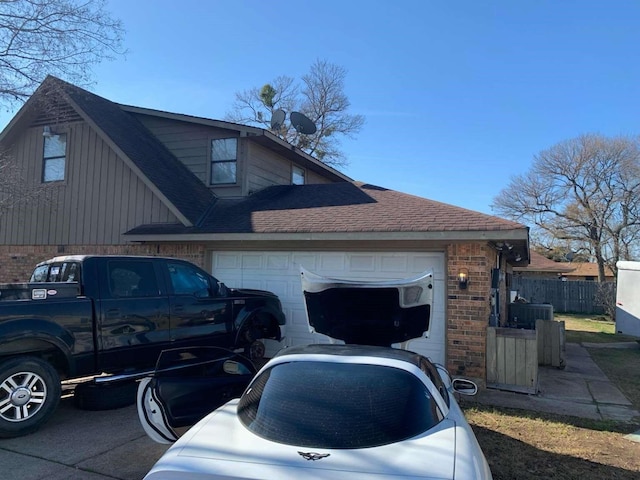 view of property exterior featuring central AC unit and a garage