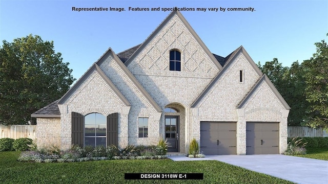 french provincial home with a garage and a front lawn