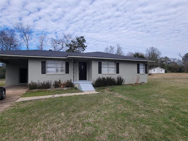 ranch-style house with a front lawn and a carport