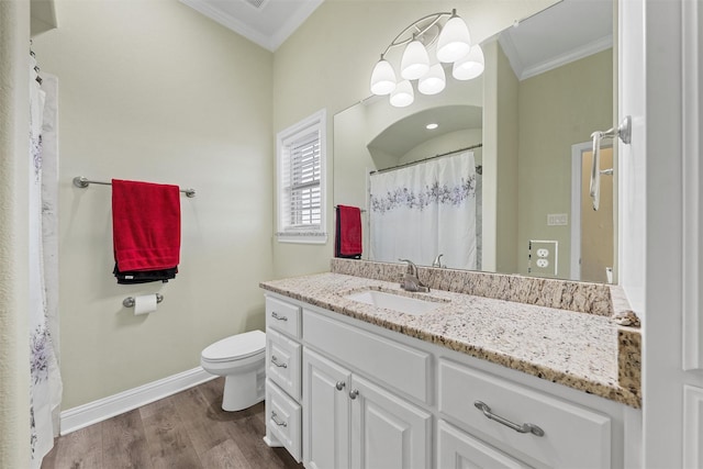 bathroom featuring vanity, hardwood / wood-style flooring, toilet, and crown molding