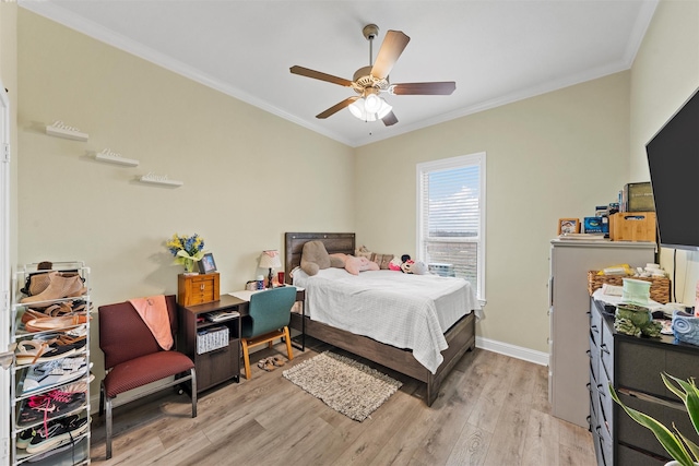 bedroom featuring ceiling fan, crown molding, and light wood-type flooring