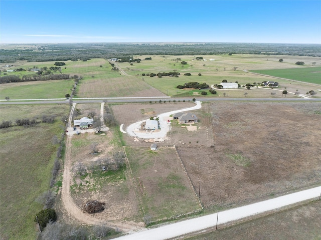 birds eye view of property with a rural view