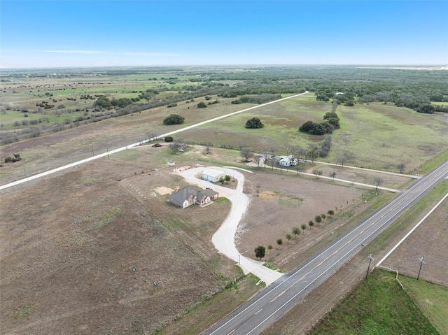 birds eye view of property with a rural view