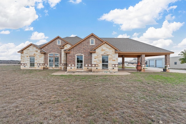 view of front of property with a front yard and a garage