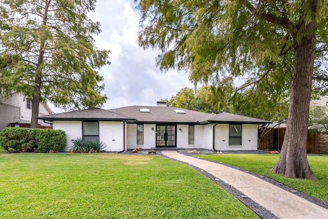 ranch-style home featuring a front yard