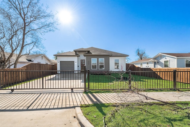 view of front facade with a garage and a front lawn