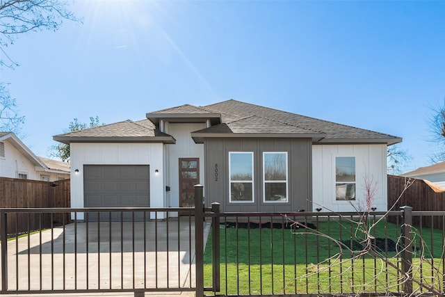 view of front of home featuring a garage and a front lawn