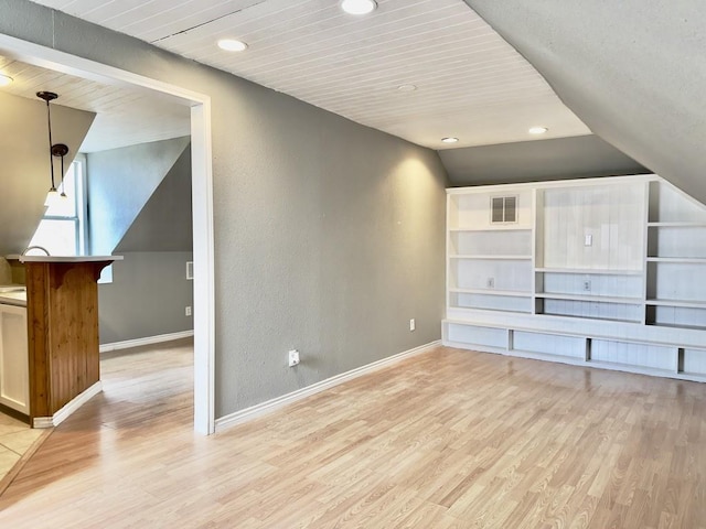 bonus room featuring wooden ceiling, lofted ceiling, and light wood-type flooring