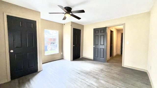 bedroom featuring ceiling fan and hardwood / wood-style flooring