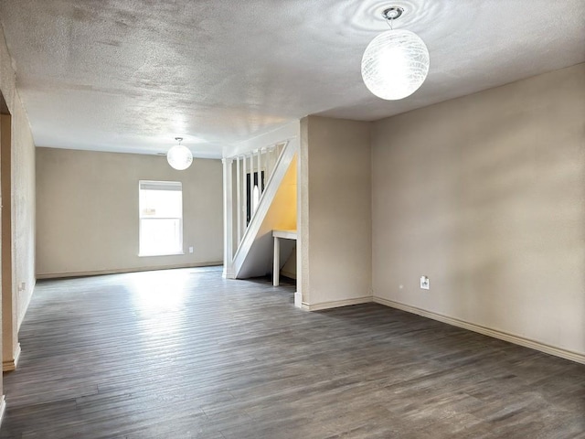 spare room with dark wood-type flooring