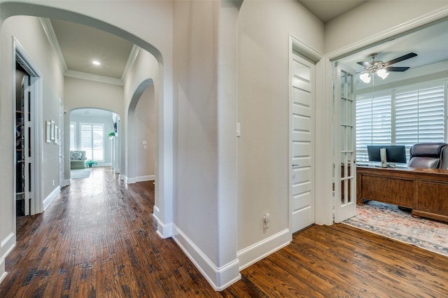 hall with ornamental molding and dark hardwood / wood-style floors