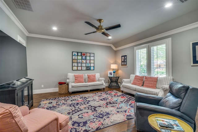 living room with crown molding, dark hardwood / wood-style flooring, and ceiling fan