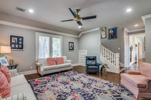 living room featuring ceiling fan, dark hardwood / wood-style floors, and ornamental molding