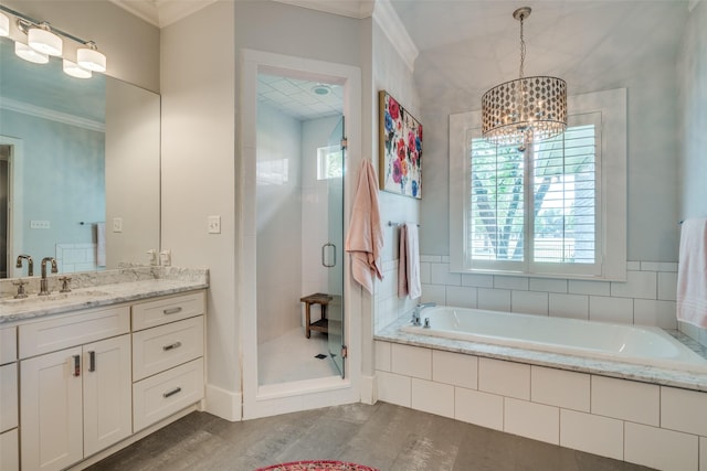 bathroom featuring plus walk in shower, vanity, an inviting chandelier, and ornamental molding