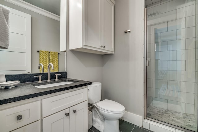 bathroom with vanity, tile patterned floors, crown molding, toilet, and a shower with shower door