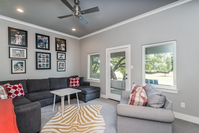 living room with light carpet, ceiling fan, and ornamental molding