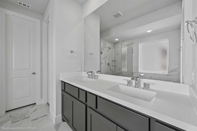 bathroom with walk in shower and vanity